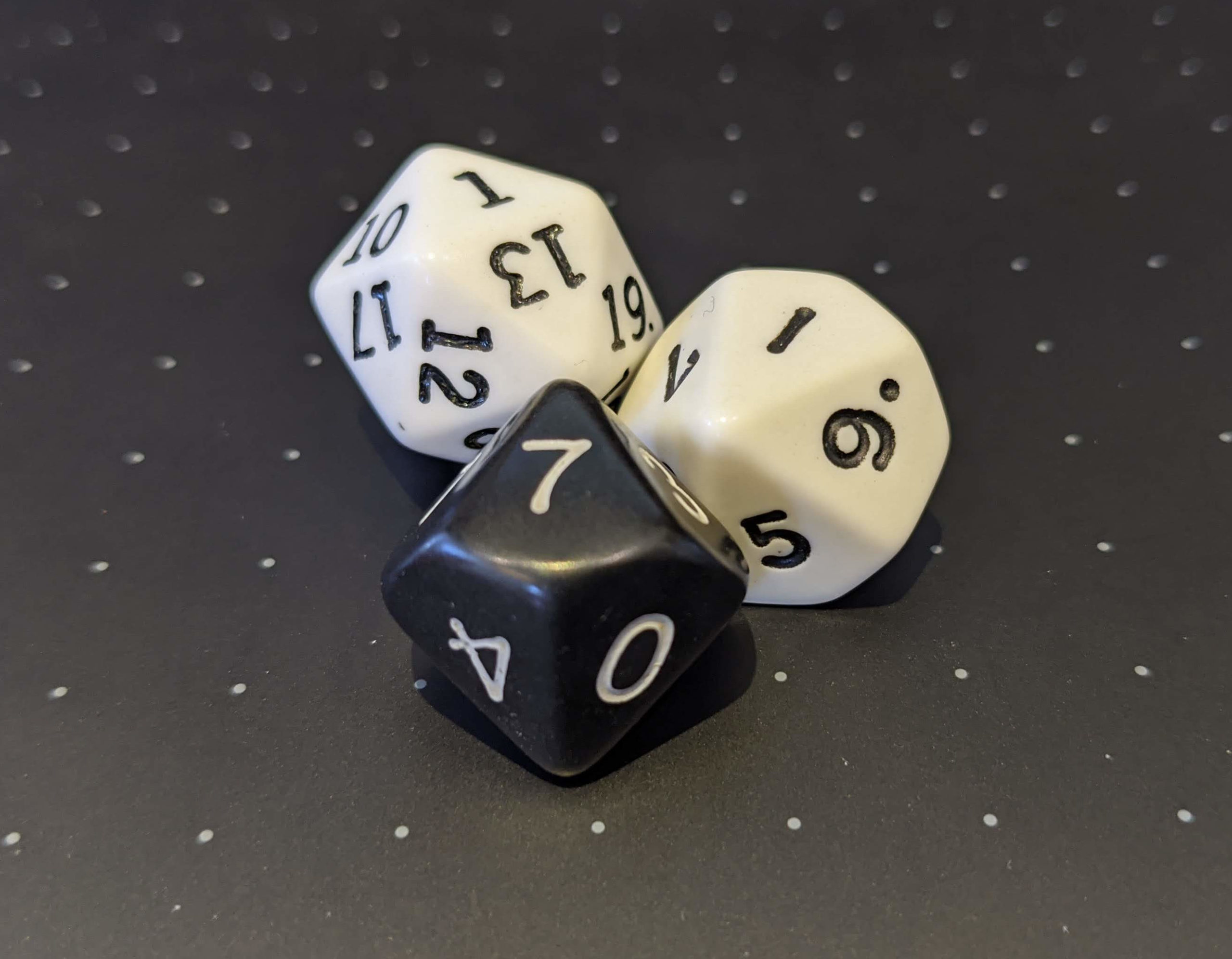 Two 10 sided dice and a 20 sided die.